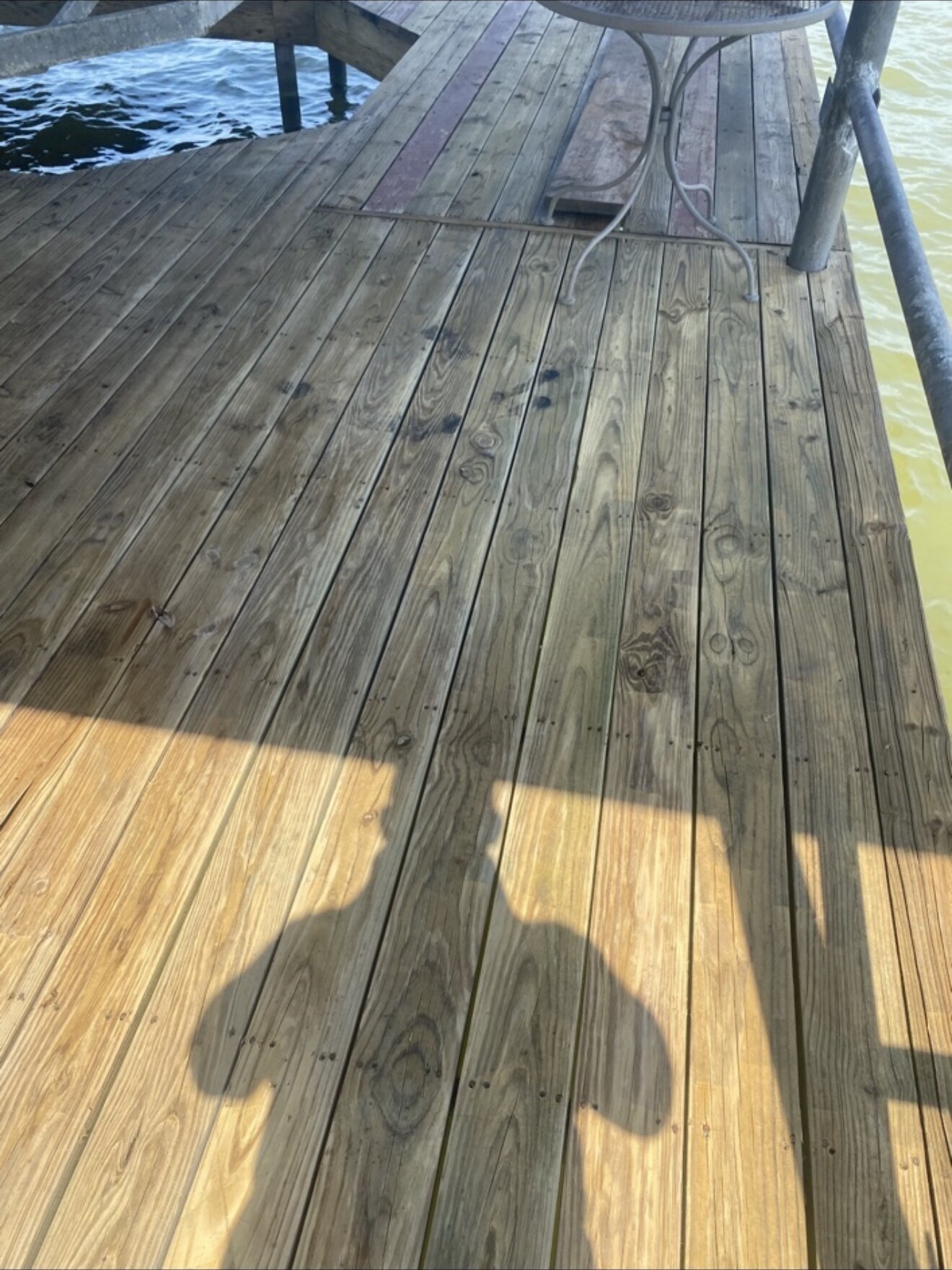 Repaired dock deck with new boards fully installed